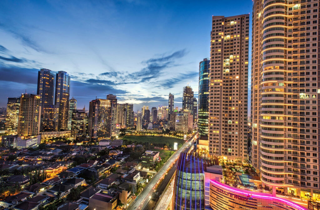 Urban Illumination: Capturing Jakarta's Stunning Skyline from a Towering Perspective Wallpaper