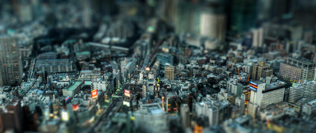 Mesmerizing Urban Miniatures: Ultra-wide 4k Background Photo Showcasing Cityscape with Intricate Road Network Wallpaper