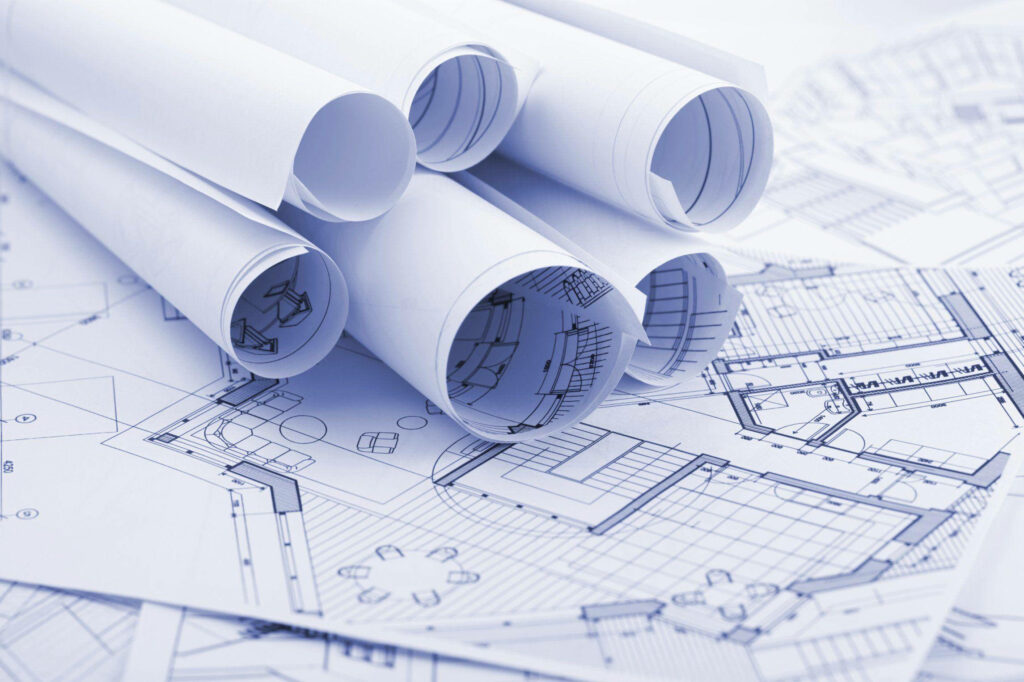 Civil engineering wallpaper with detailed architectural blueprints and rolled plans in blue tones