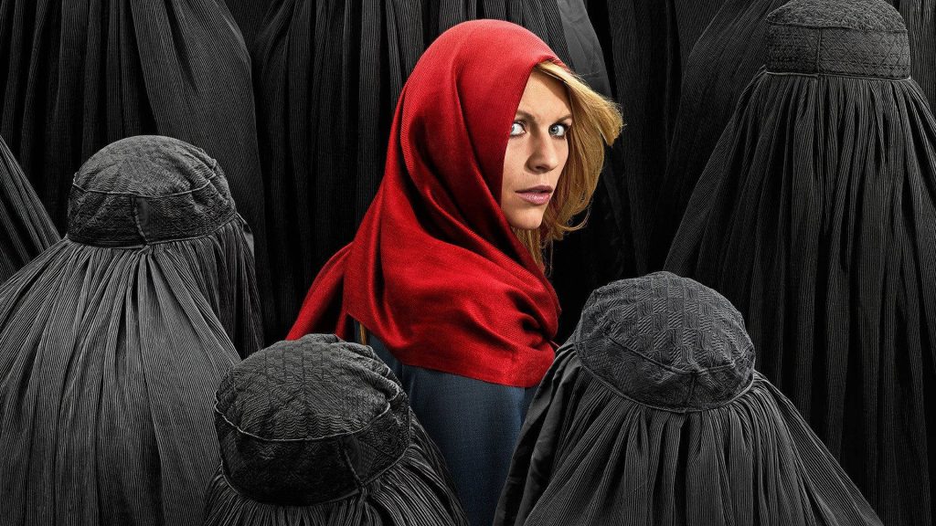 Claire Danes as Carrie Mathison in red headscarf among black burqas intense Homeland wallpaper