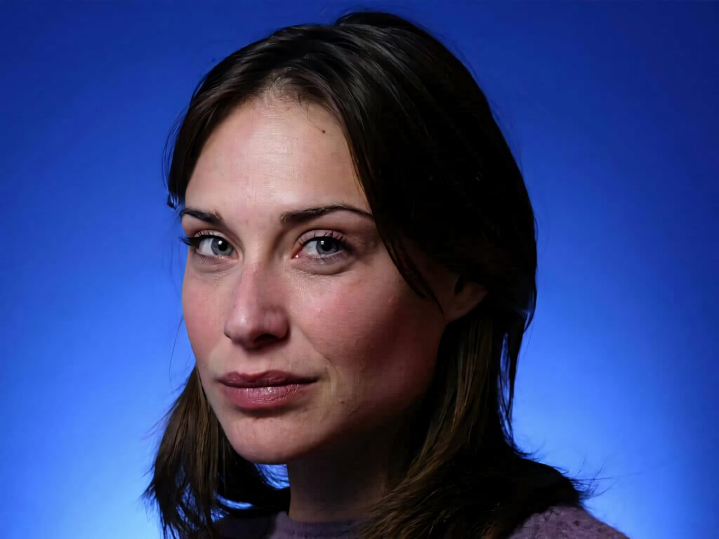 Claire Forlani close-up portrait with serene expression blue gradient background minimalist style Wallpaper