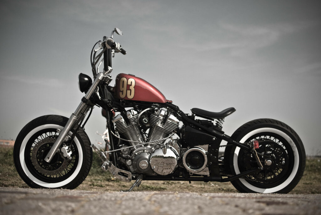 Vintage American Bobber Motorcycle Wallpaper with Bold Red Tank
