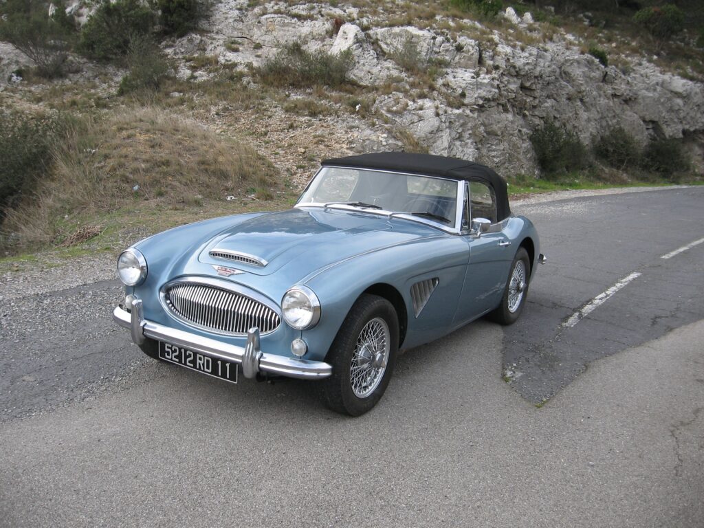 Classic Austin Healey MK3 Sports Car by Scenic Roadside Background Wallpaper