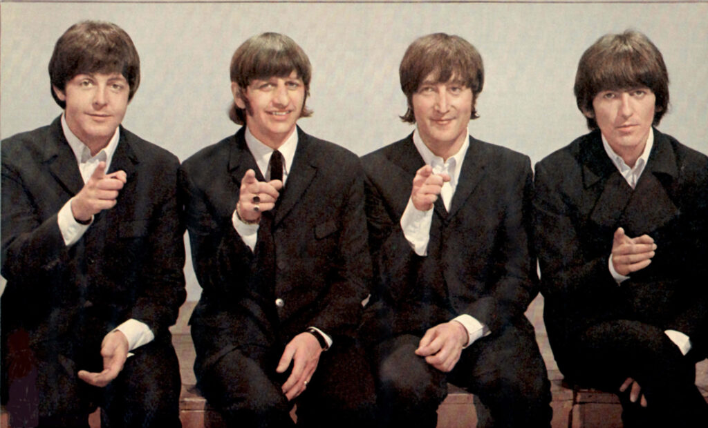 Cheerful Beatles Wallpaper: Iconic Band Members in Classic Style