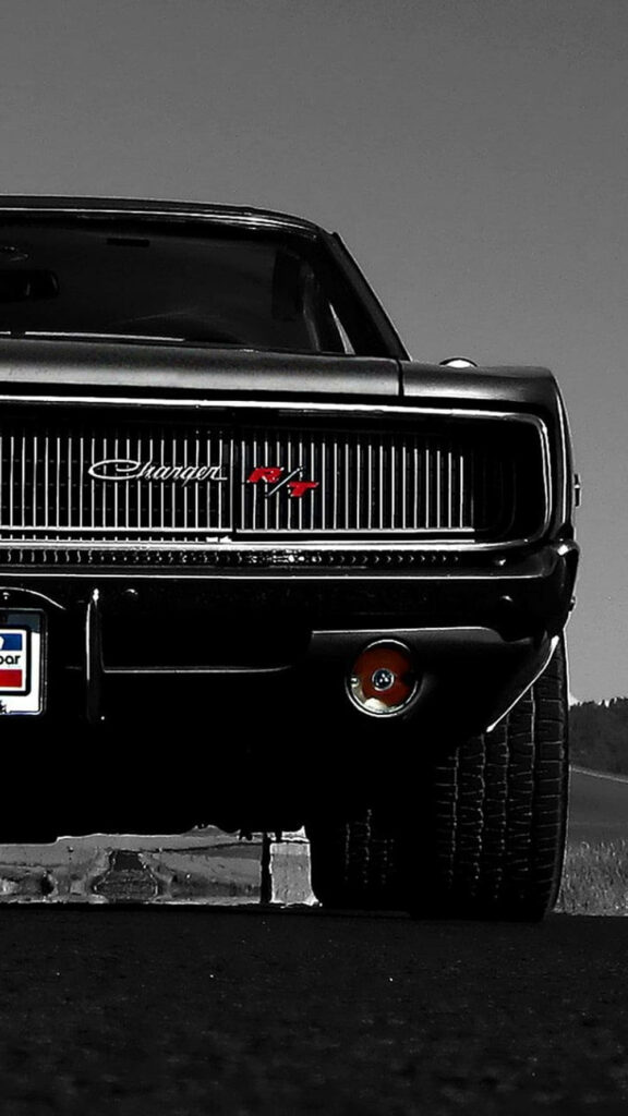 Classic black Dodge Charger front view wallpaper showcasing iconic grille and muscle car power