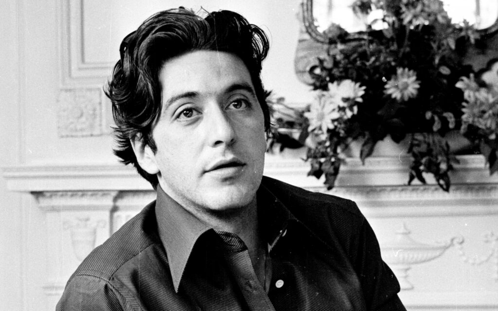 Classic black and white portrait of young Al Pacino photoshoot with thoughtful expression wallpaper