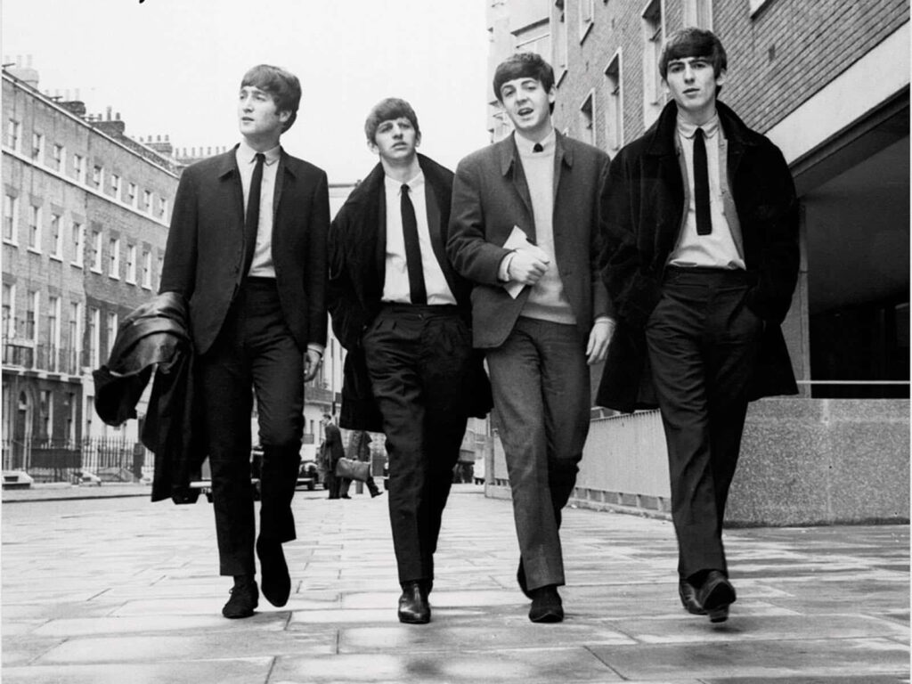 Classic Beatles Wallpaper: Iconic Black-and-White City Stroll