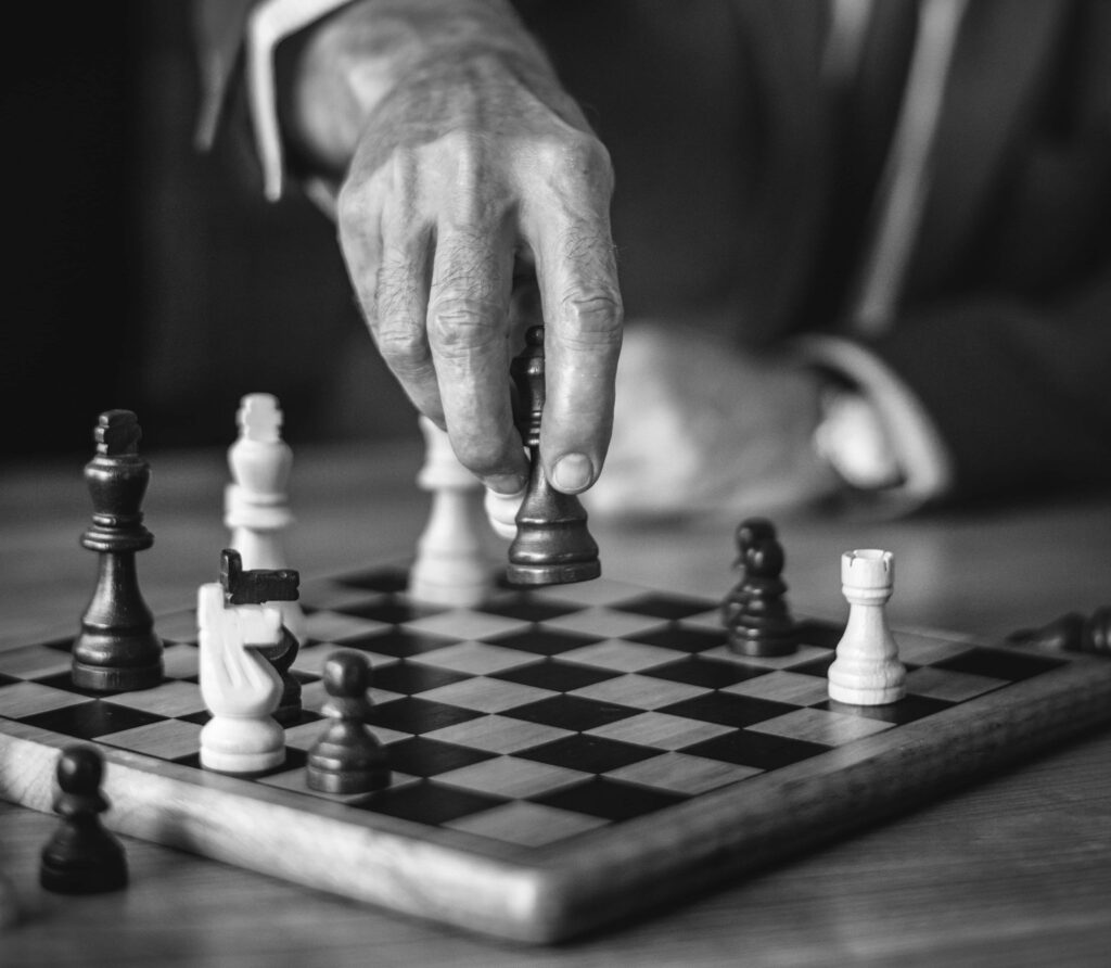 Classic Black & White Chessboard with Strategic Move Background Wallpaper