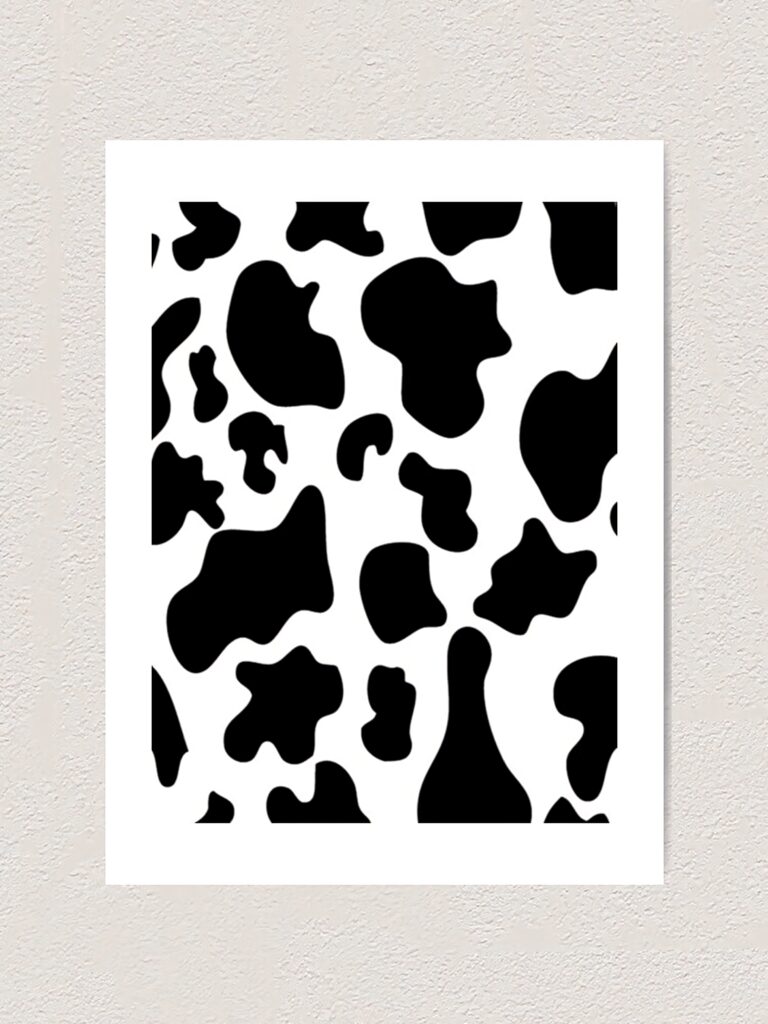 Black and white cow print wallpaper with bold irregular patches for modern trendy decor background