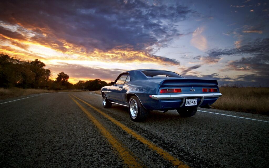 Classic Camaro at Sunset: Vintage Car Wallpaper in Vibrant Colors