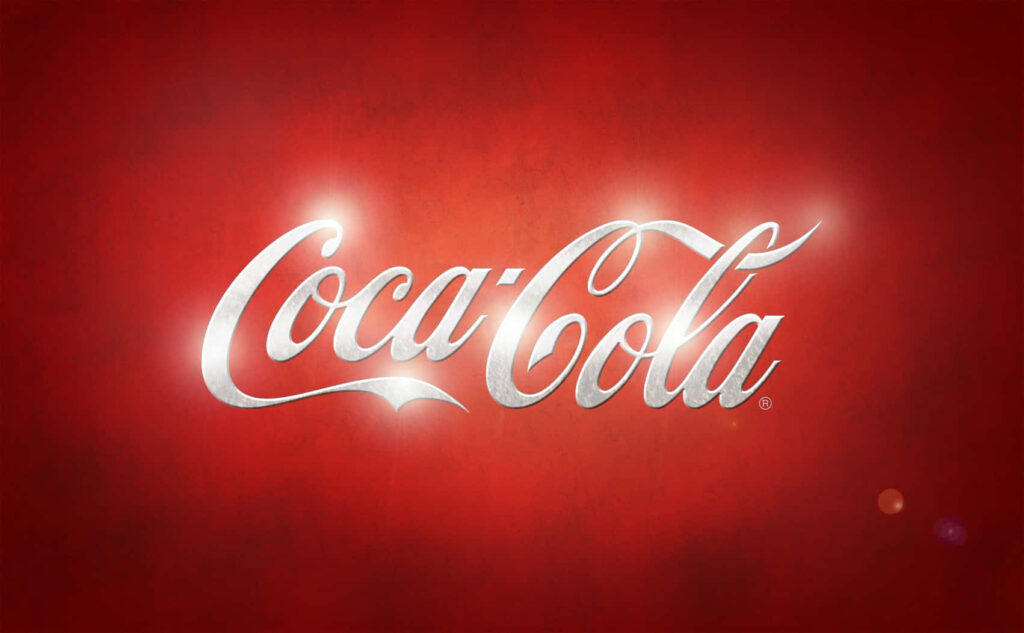 Coca-Cola logo white script on vibrant red background with subtle glow classic brand wallpaper