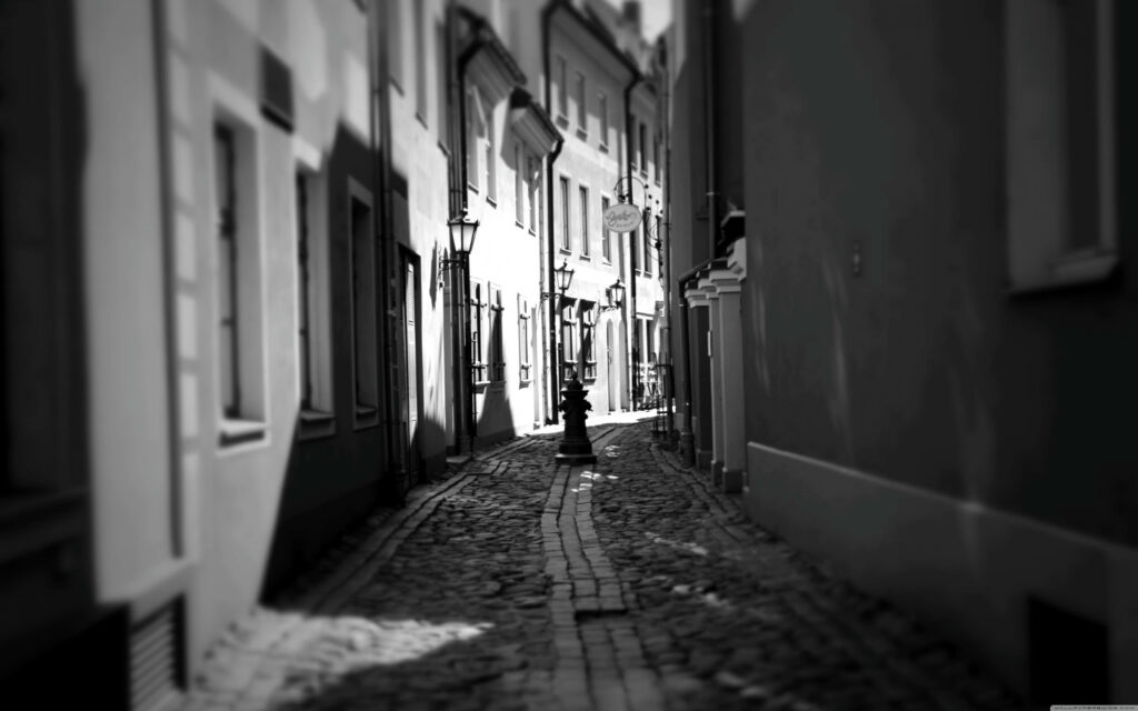 Black and White Wallpaper: Nostalgic Cobblestone Street in Riga