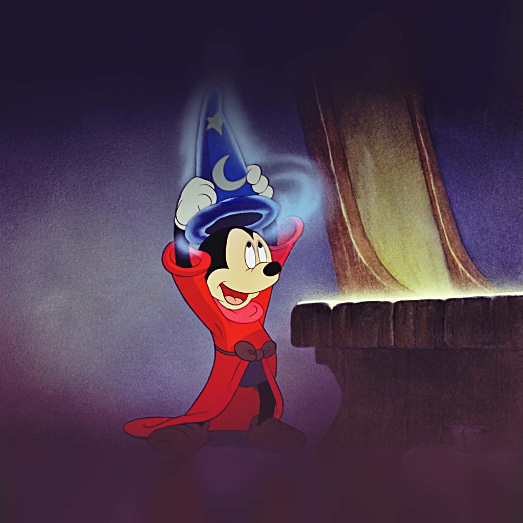 Disney Fantasia wallpaper featuring Mickey Mouse Sorcerer's Apprentice in red robe with glowing magic hat
