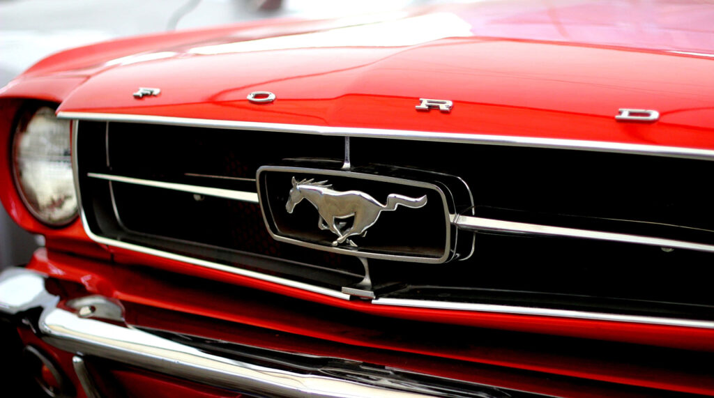 Classic Ford Mustang Grille Wallpaper - Sleek Design & Power Emblem