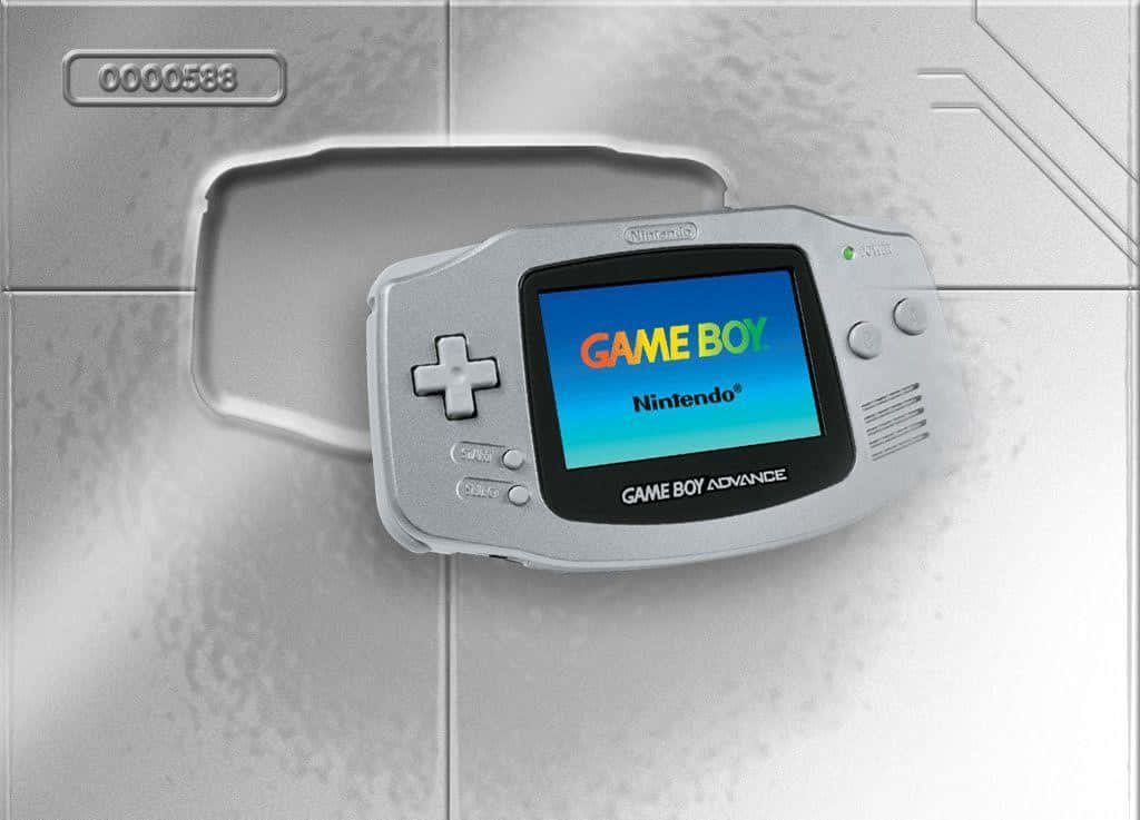 Silver Game Boy Advance with Nintendo logo on screen against metallic industrial background wallpaper