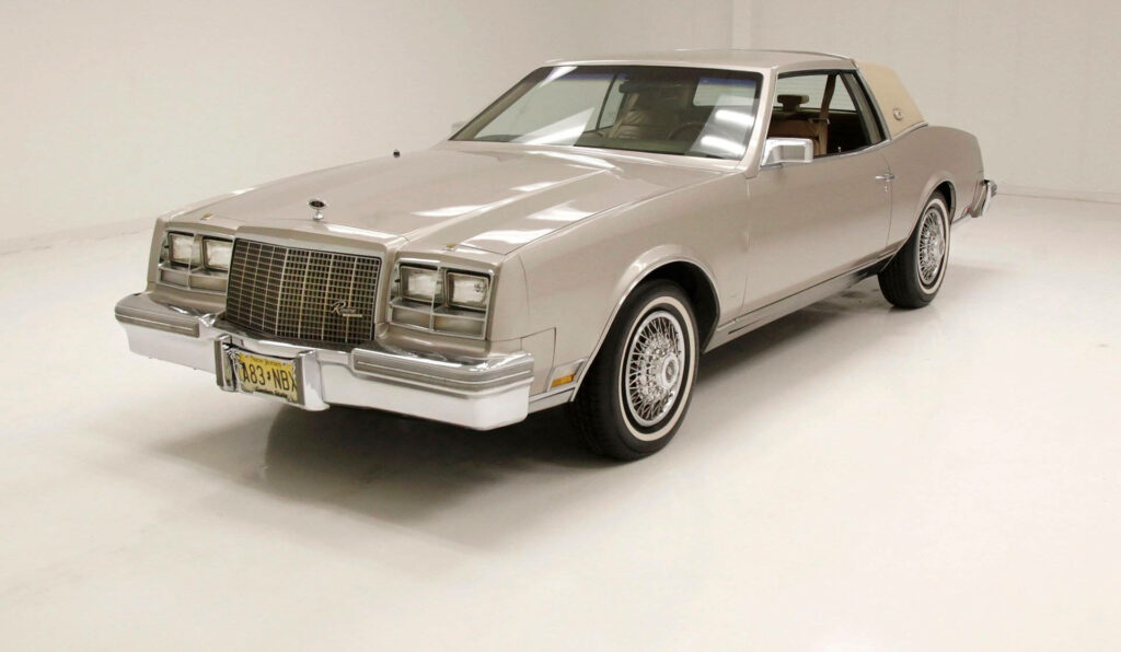 Grey Buick Riviera classic car wallpaper with elegant lines in minimalistic studio setting