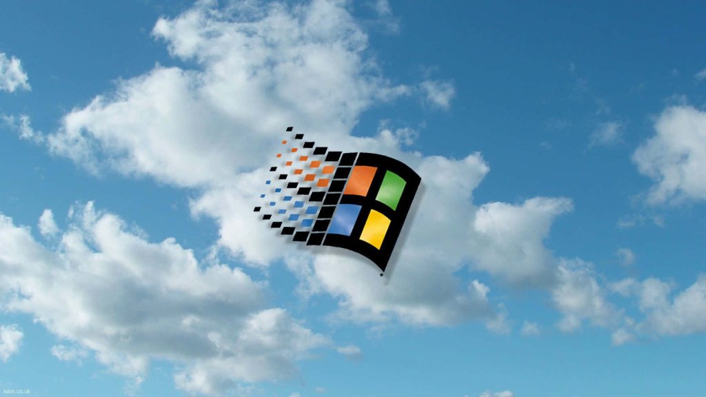 Classic Microsoft Windows logo waving flag bright blue sky fluffy clouds 90s tech wallpaper