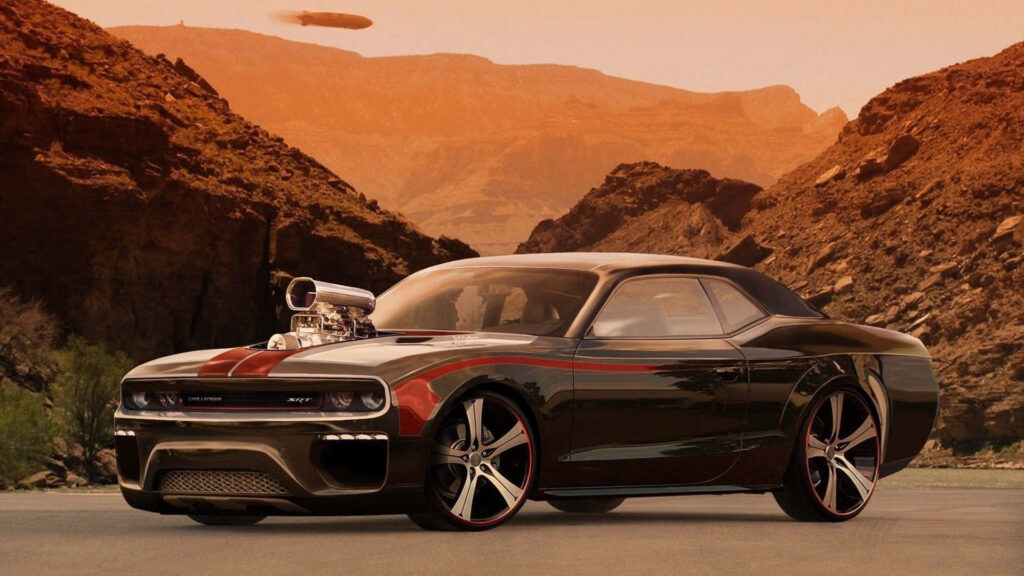 Classic muscle car with supercharged engine parked in desert mountains under warm orange sky Wallpaper
