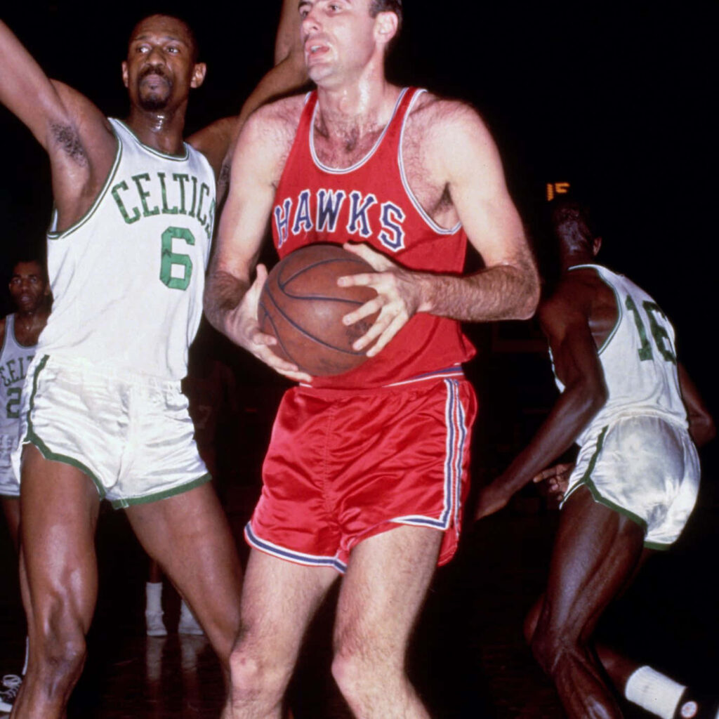 Vintage NBA game action Bob Pettit Hawks vs Bill Russell Celtics retro basketball wallpaper