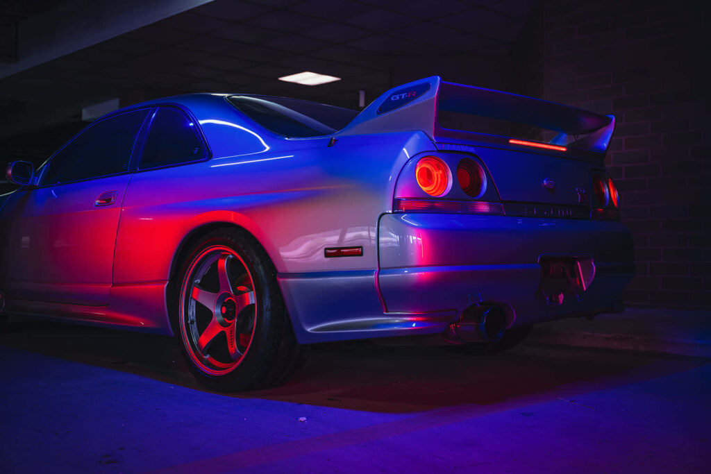 Neon Nissan Skyline R33 GTR Wallpaper – Classic Automotive Aesthetic
