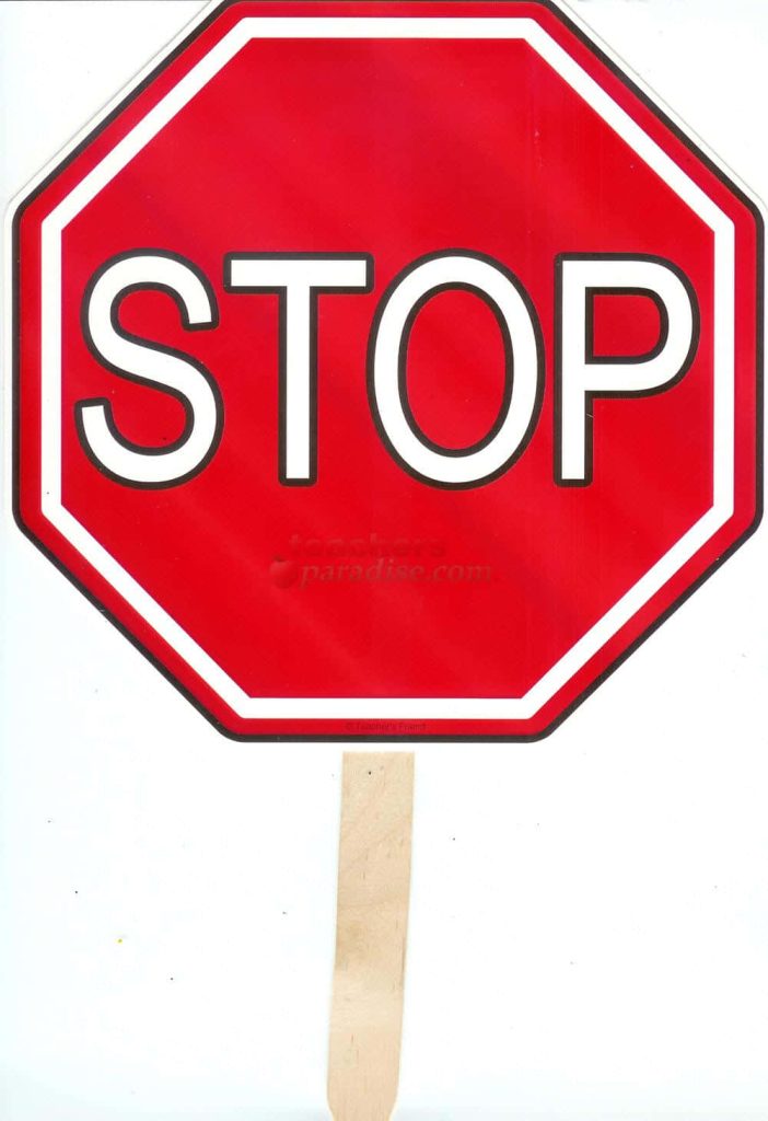 Handheld red and white octagonal stop sign on wooden handle for safety education and traffic decor Wallpaper