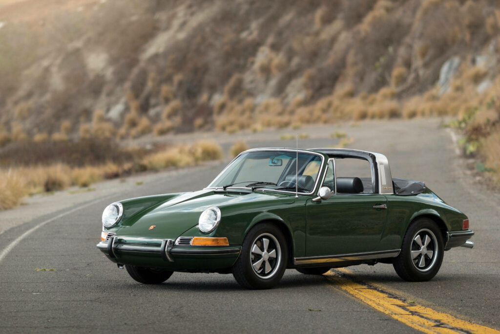 Vintage Porsche 911 Convertible Wallpaper in Earthy Green Setting