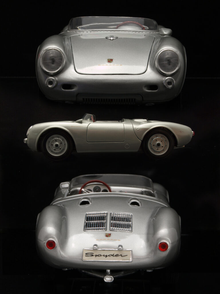 Timeless Gray Porsche Spyder Wallpaper on Minimalist Black Background