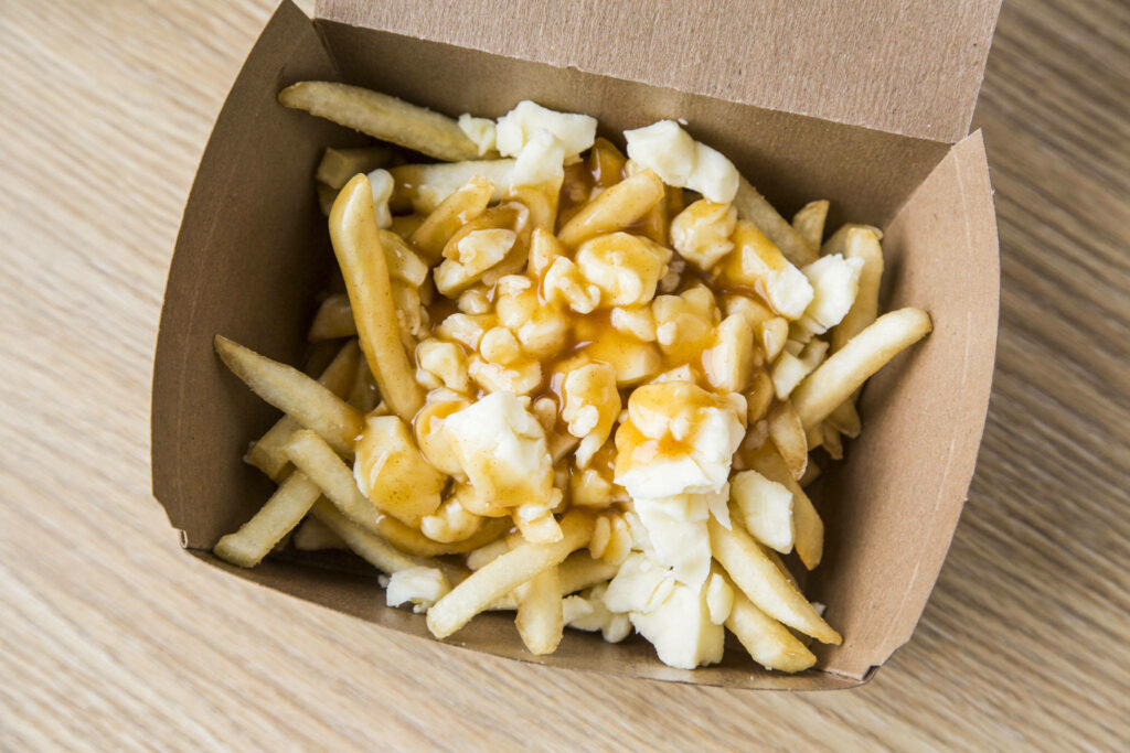 Mouthwatering Poutine Wallpaper: Comforting Take-Out Delight
