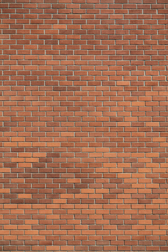 Classic Red Brick Wall Wallpaper: Uniform Texture & Earthy Tones