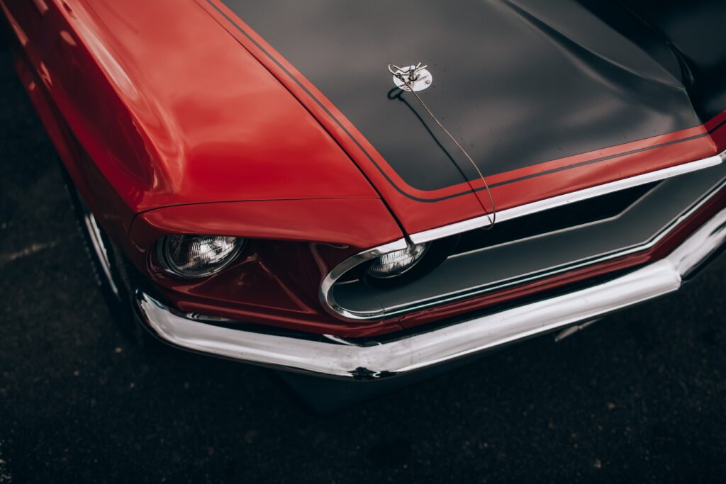 Stunning Close-Up of a Vintage Red Car with Chrome Highlights Wallpaper