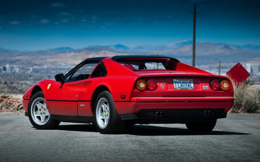 Classic 1985 Ferrari 328 GTS Wallpaper: Stunning Rear View Background