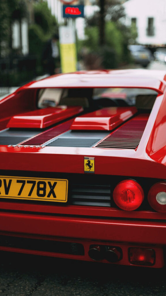Rear view of classic red Ferrari supercar wallpaper showcasing iconic design and vibrant color