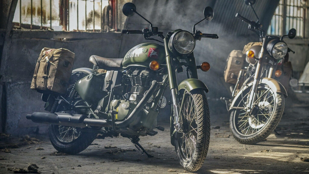 Stunning Royal Enfield Motorcycles in Rustic Garage Wallpaper