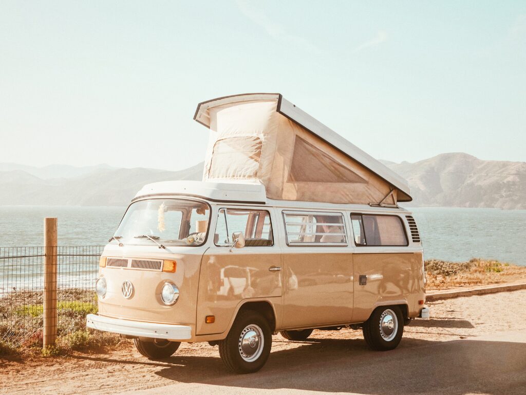 Iconic Volkswagen T2 Van in Serene Outdoor Adventure Setting Wallpaper