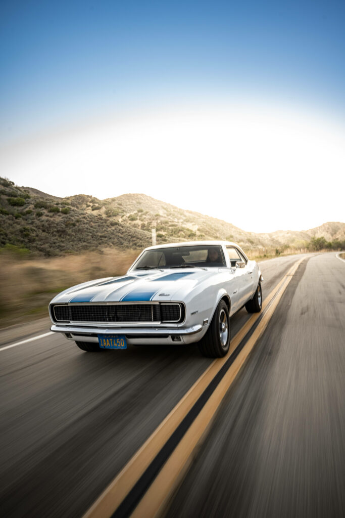 Classic White Chevrolet Muscle Car Wallpaper - Scenic Open Road