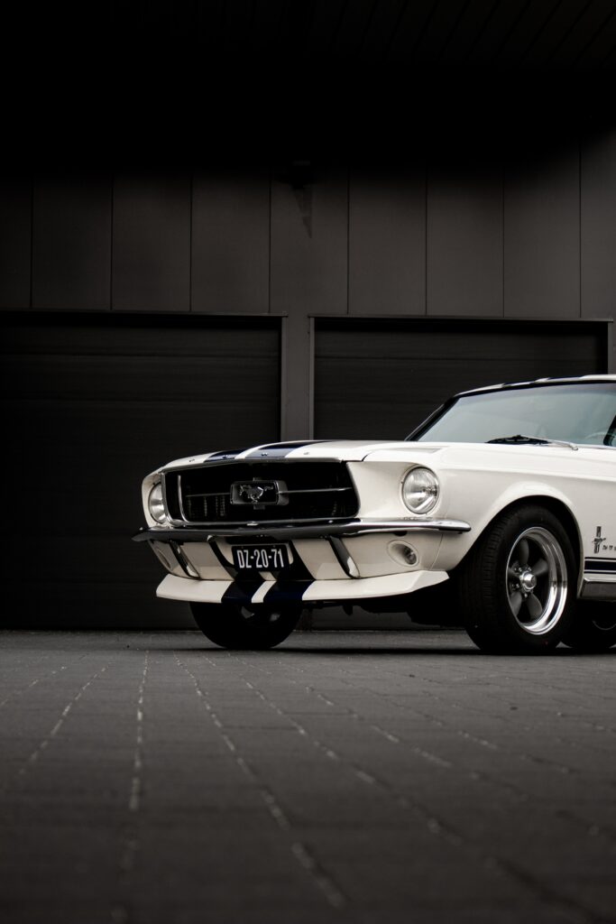 Classic White Ford Mustang Wallpaper: Iconic Design on Dark Background