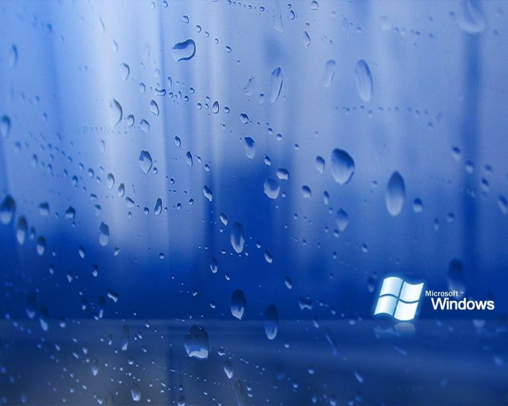 Windows 7 HD wallpaper with vibrant blue water droplets and classic Microsoft Windows logo background