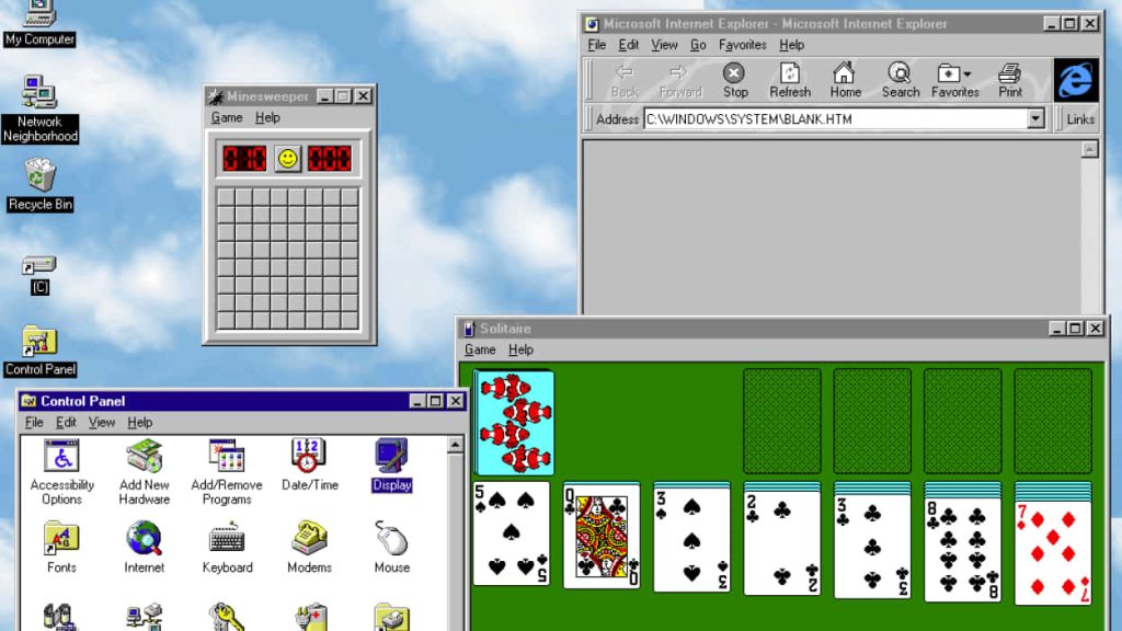 Windows 95 desktop wallpaper with classic sky-blue clouds Minesweeper Solitaire Internet Explorer