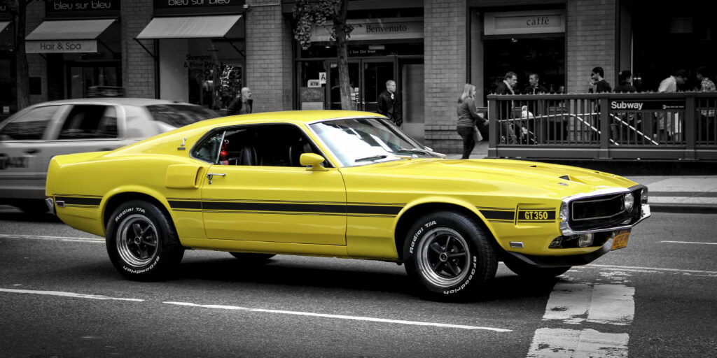 Classic Yellow Ford Mustang GT Wallpaper - Iconic Muscle Car Design
