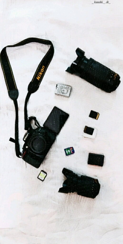 Flat lay of Nikon DSLR camera lenses memory cards battery with digital sketch effect wallpaper