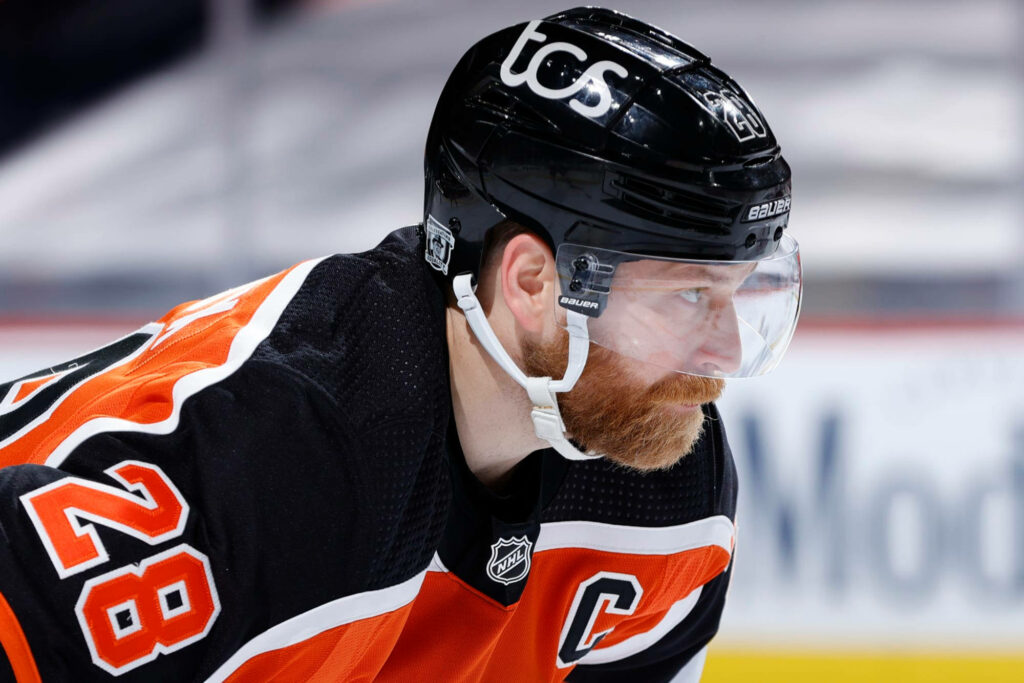 Claude Giroux in Philadelphia Flyers jersey intense hockey action close-up wallpaper background