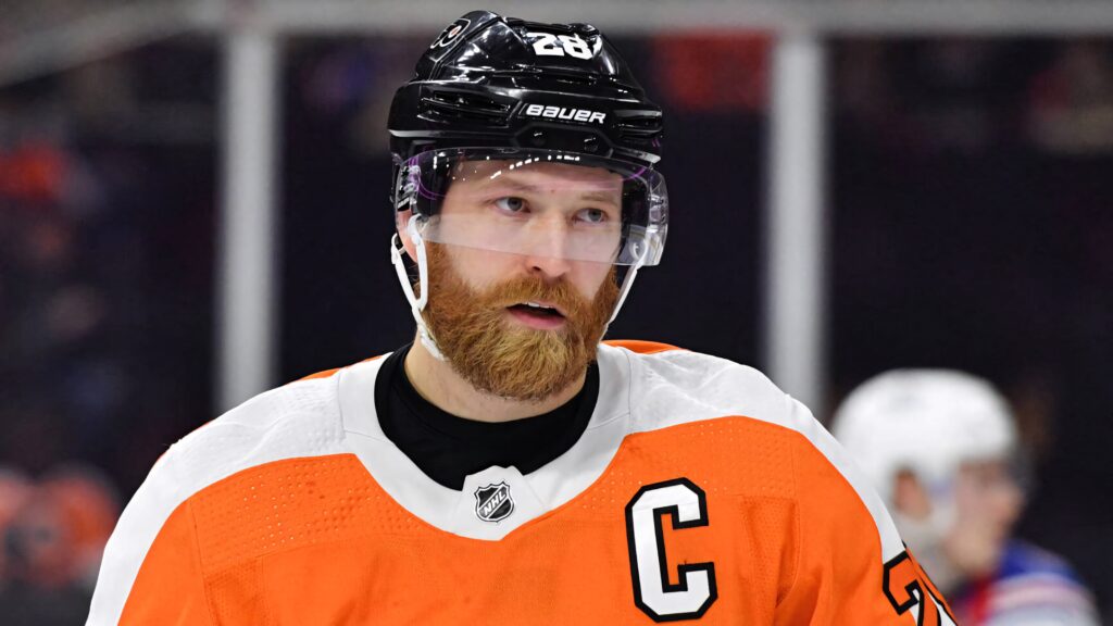 Claude Giroux close-up in Philadelphia Flyers uniform with intense stare and detailed gear Wallpaper