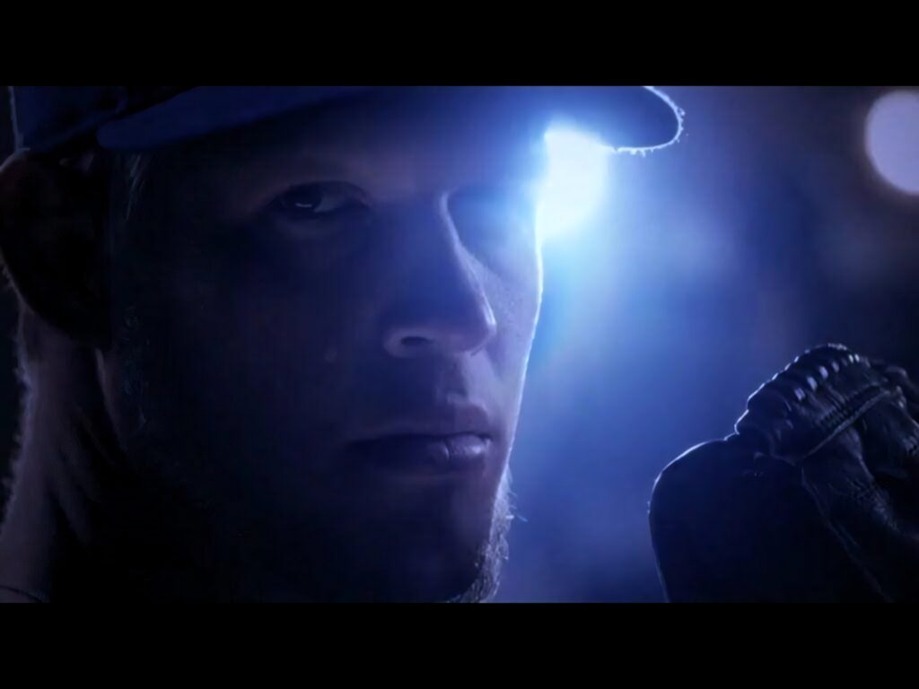 Clayton Kershaw intense close-up with blue backlight showing focus and baseball glove background Wallpaper