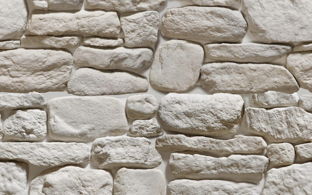 Whitewashed Serenity: A Close-Up of a Stone Wall in Aesthetic Desktop Wallpaper