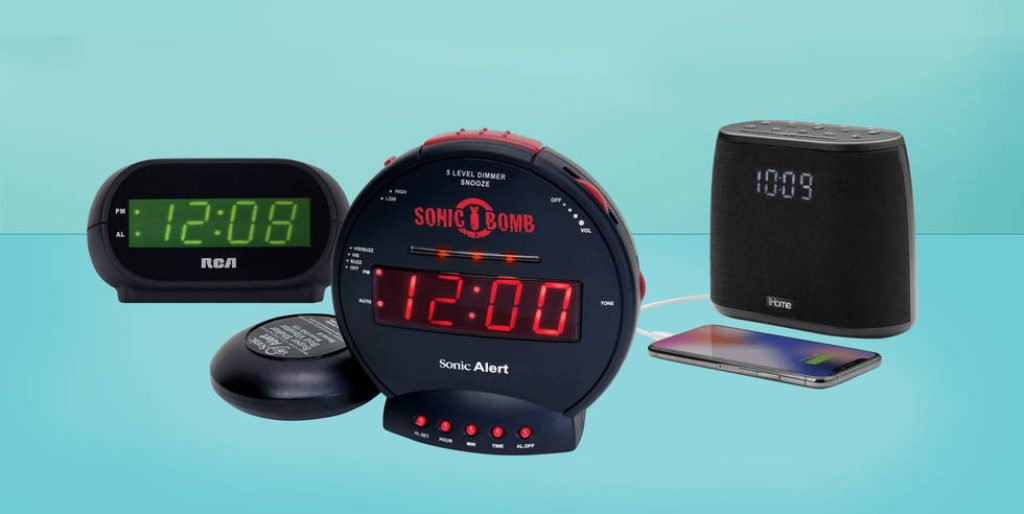 Clean tech wallpaper showing RCA green LED clock Sonic Alert Bomb and iHome speaker