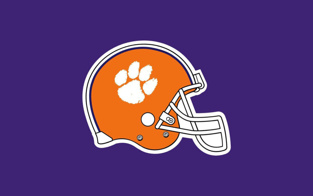 Clemson Tigers football helmet orange with white paw print on purple background wallpaper