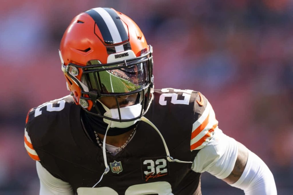 Cleveland Browns player number 32 in orange helmet with reflective visor intense NFL wallpaper