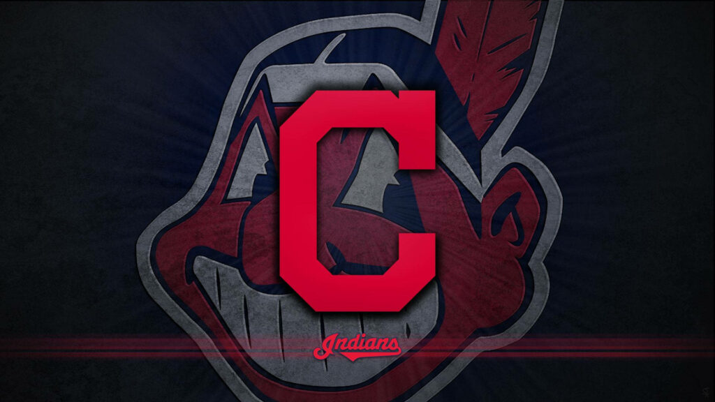 Cleveland Indians wallpaper red block C logo with faint Chief Wahoo on dark sports background