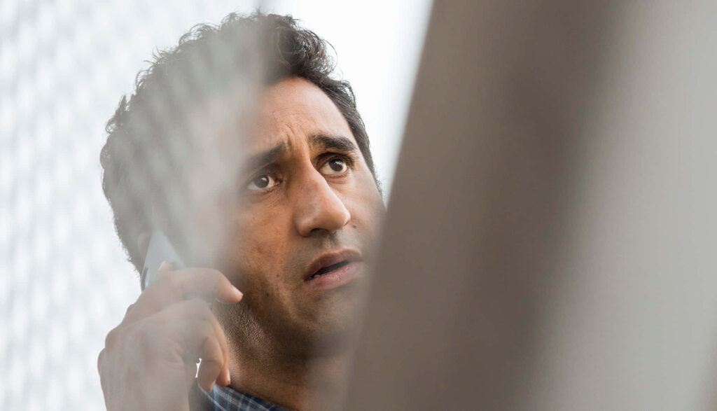 Cliff Curtis dramatic close-up speaking on phone cinematic muted tones intense emotional wallpaper