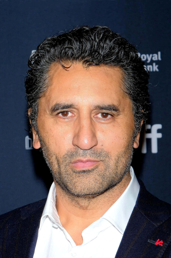 Cliff Curtis portrait in sharp suit on dark background high resolution natural tones wallpaper